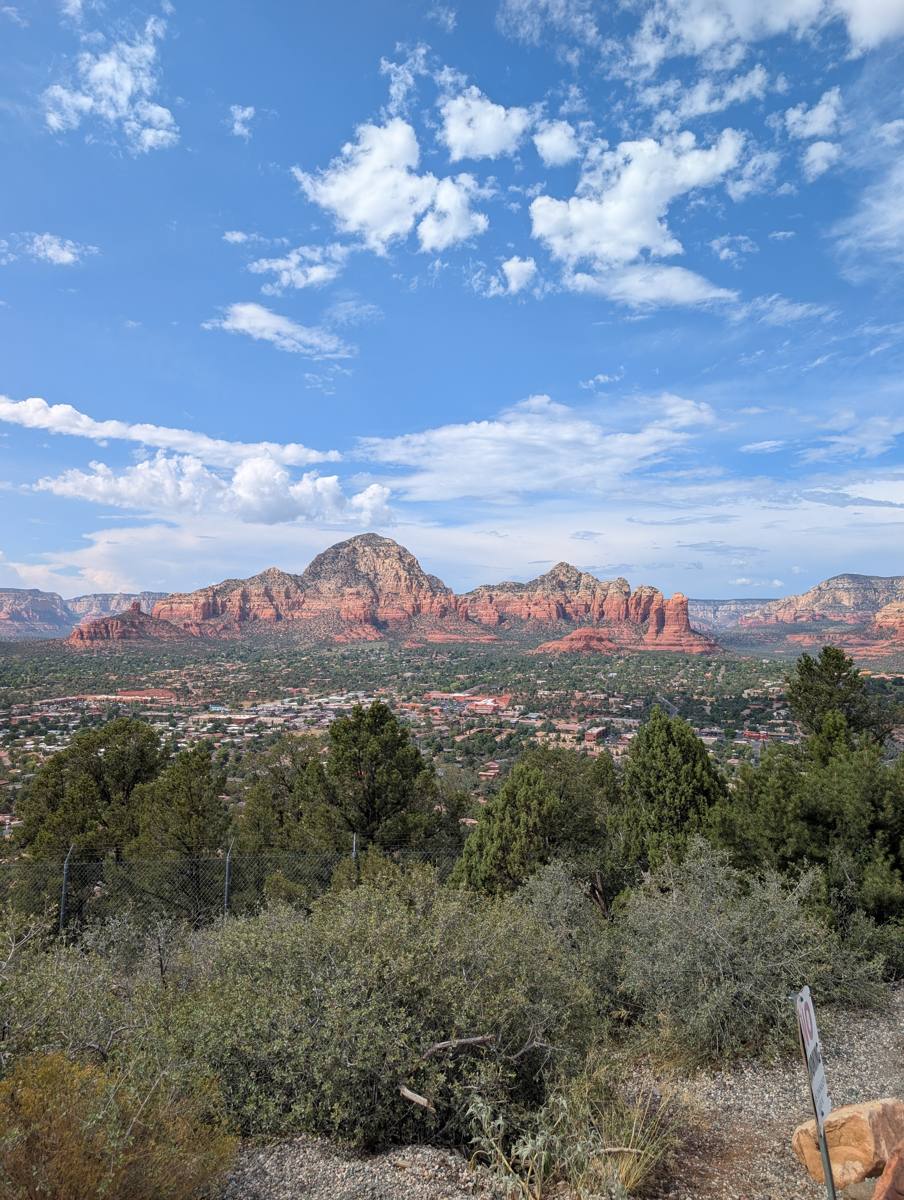 Panorama of Sedona red rocks under monsoon clouds