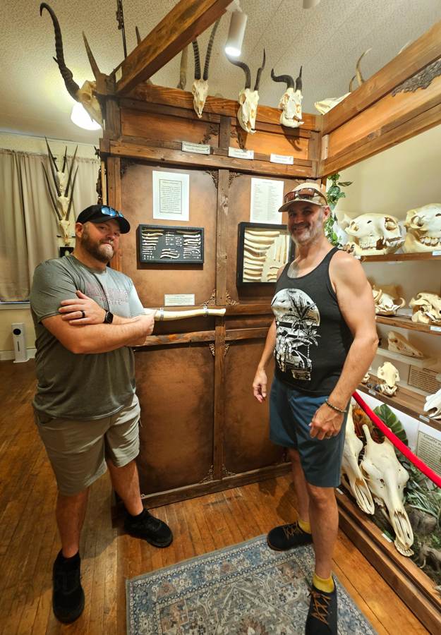 Matt and Frank inside the Skullatorium surrounded by skulls